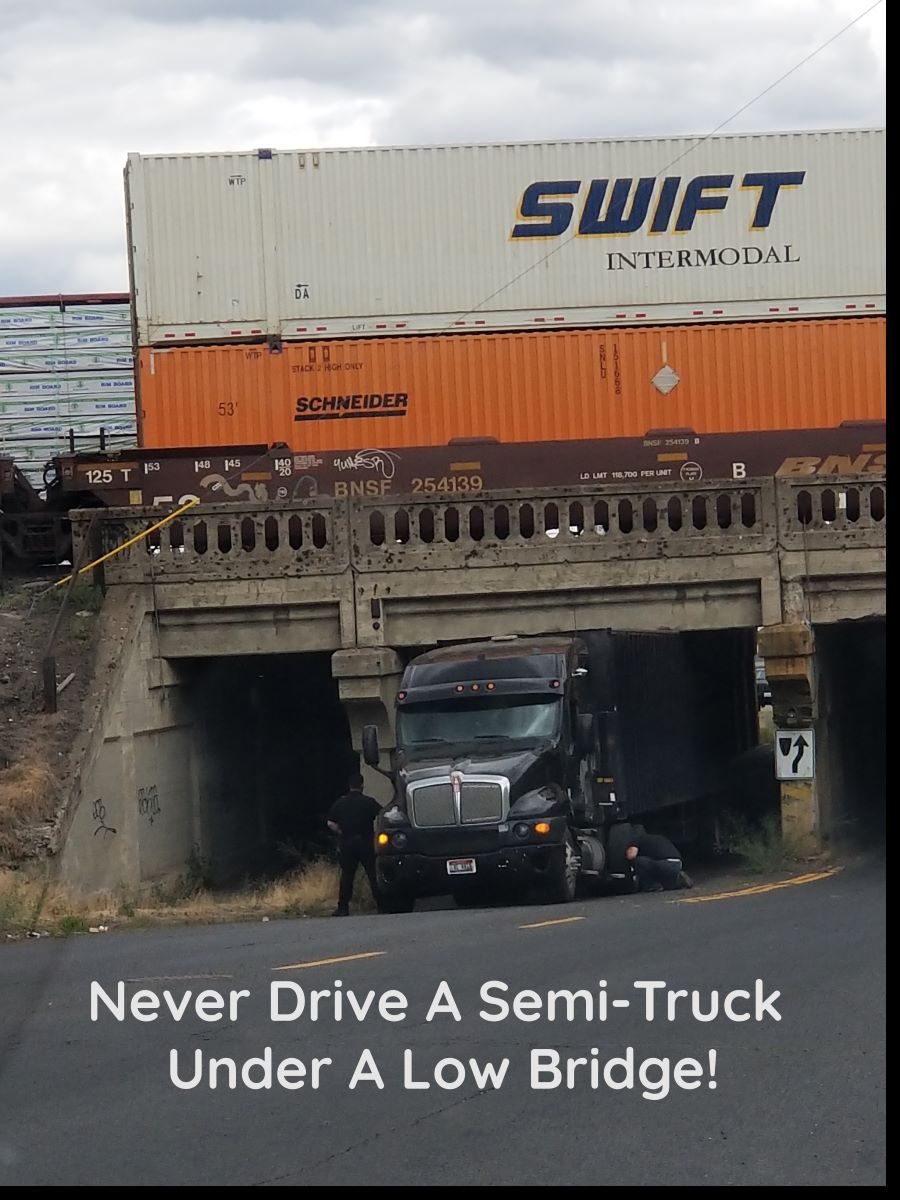 semi-truck stuck in low bridge
